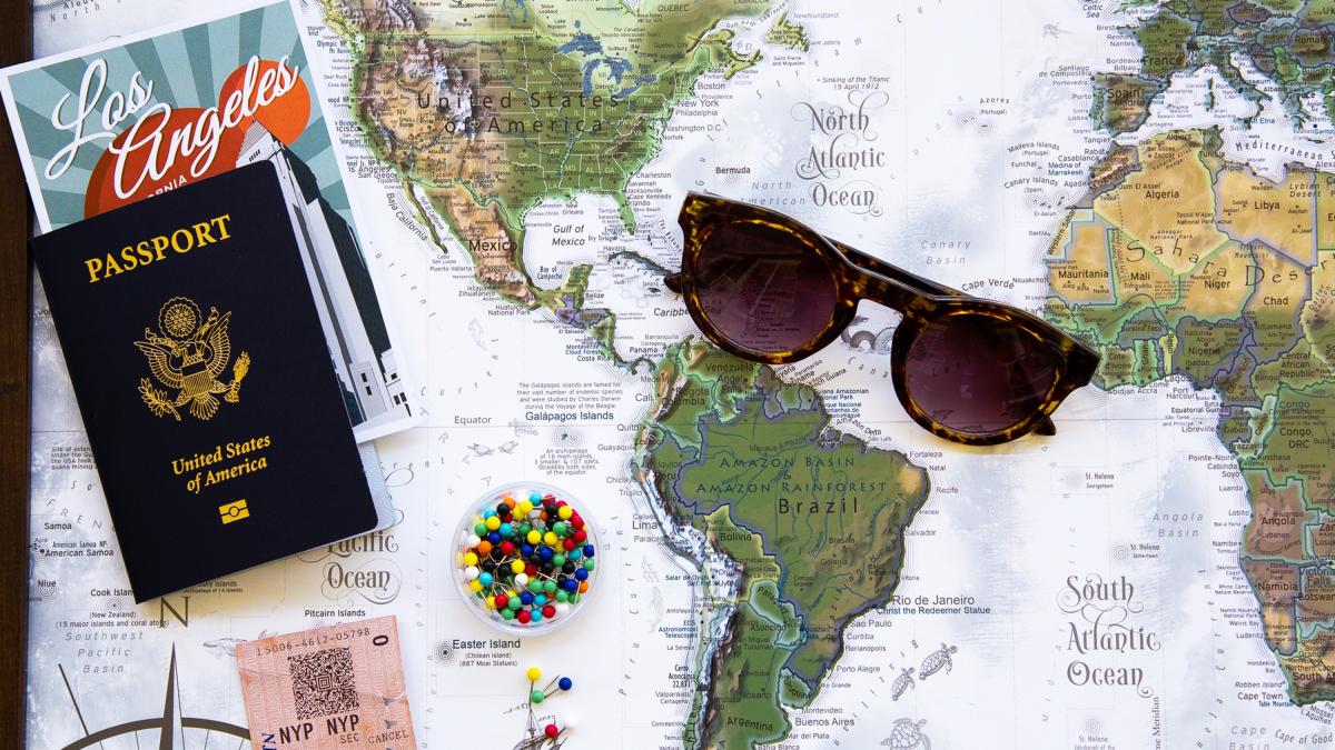 Travel map, passport, glasses