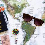 Travel map, passport, glasses